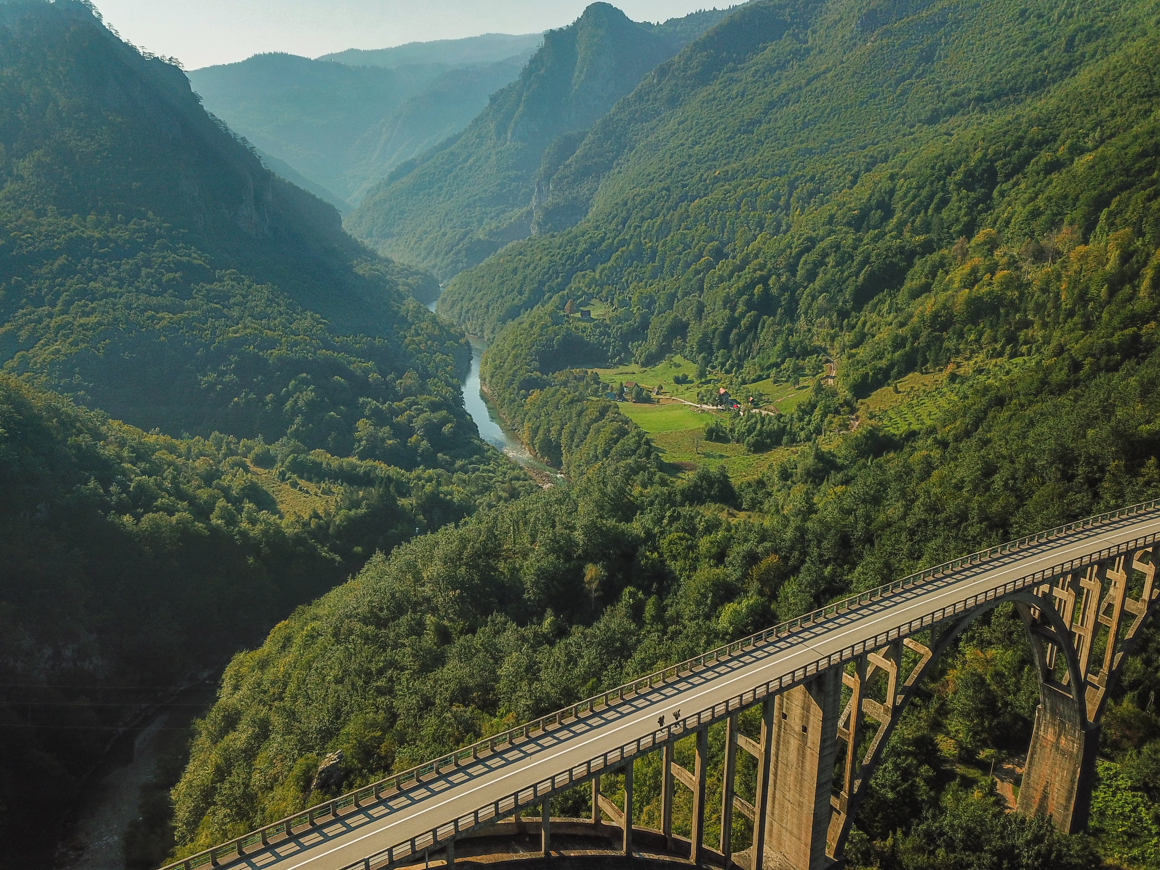 background image with mountains and a car